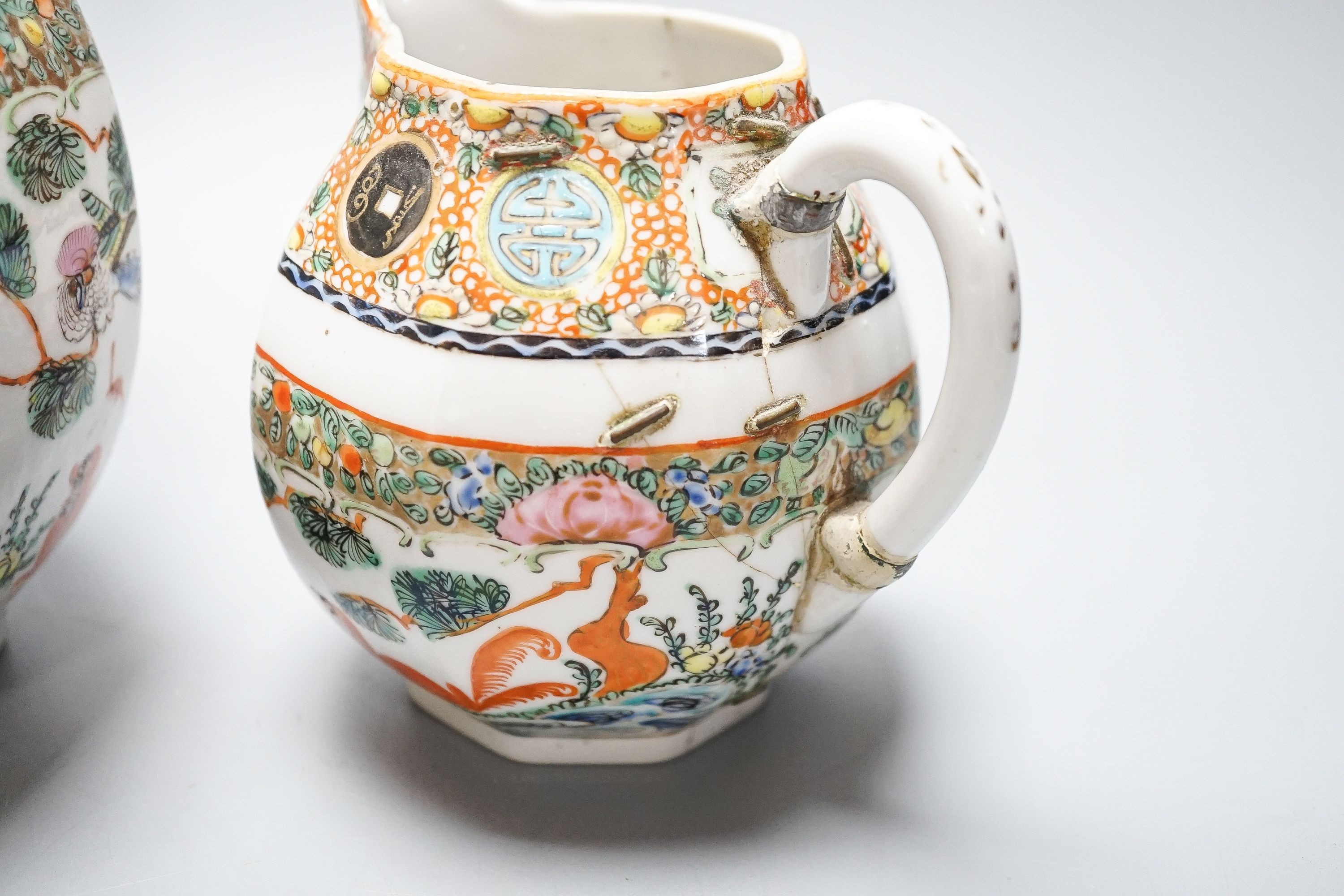 A Chinese celadon glazed vase, 24cm and a Chinese famille rose teapot and matching cream jug, a.f.